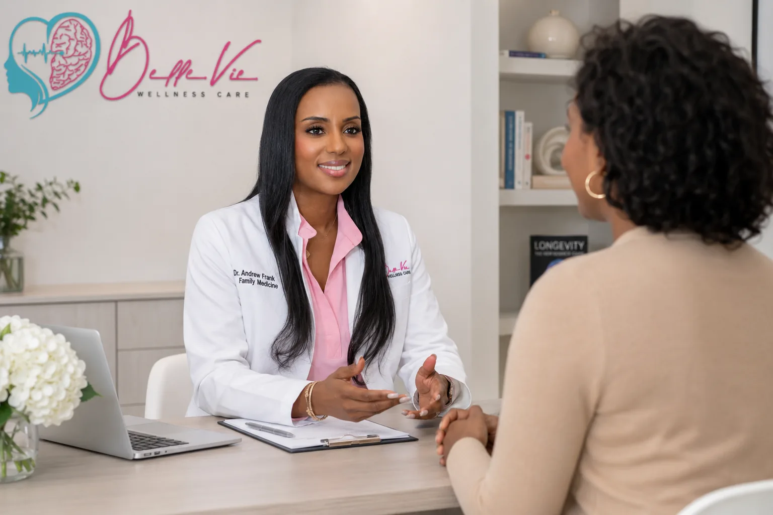 Dr. Andrelle Franck speaking with a patient during a concierge medicine visit